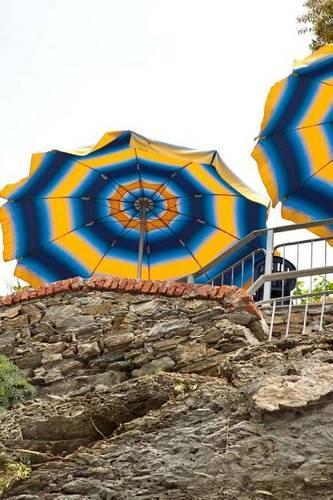 Blue and Yellow Umbrellas at a Cafe on the Cliff
